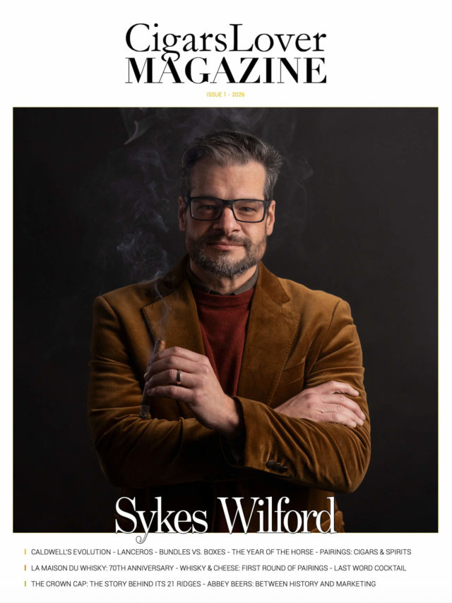 CigarsLover Magazine Issue 1 2026 cover featuring Sykes Wilford holding a cigar with smoke on a dark background